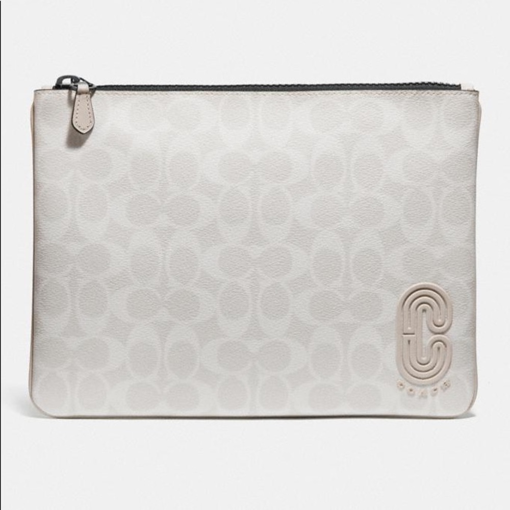 Pouch in signature canvas with Coach patch